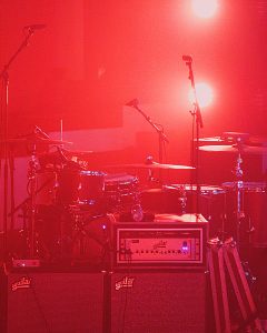 Live Concert Stage with Drums and Musical Instruments